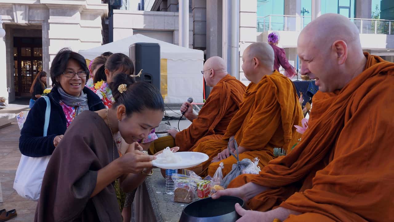 Blessing by Monks gift offering Songkran Festival Perth Australia